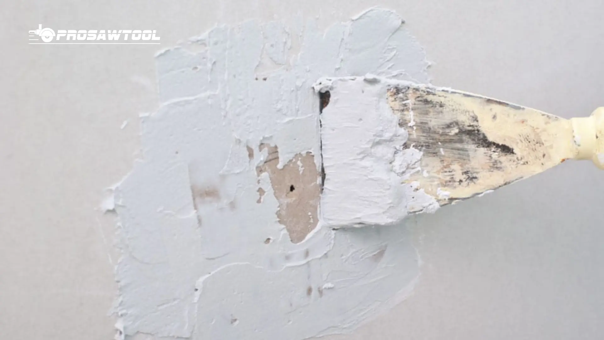 Spread Drywall Patch Material to the Wall Patch
